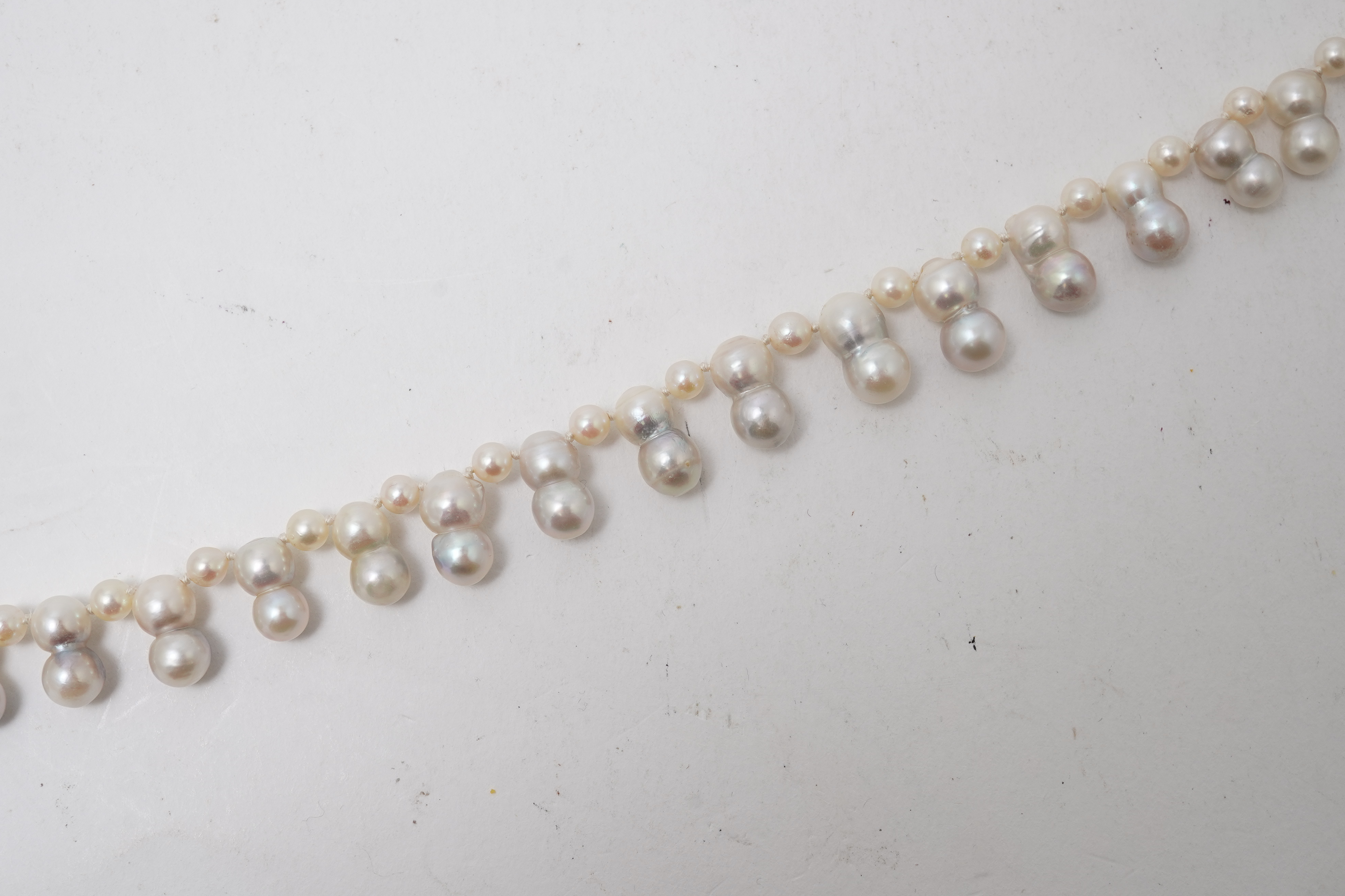 A collection of four cultured pearl necklaces
